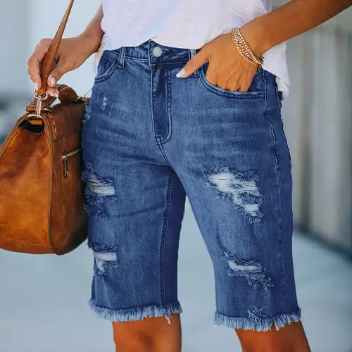 Distressed denim Bermuda shorts with ripped holes and raw hem, fringed high elasticity design