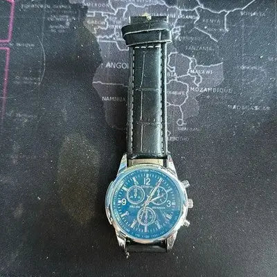 Silver-cased Geneva Men’s Quartz Watch with blue dial and black leather strap