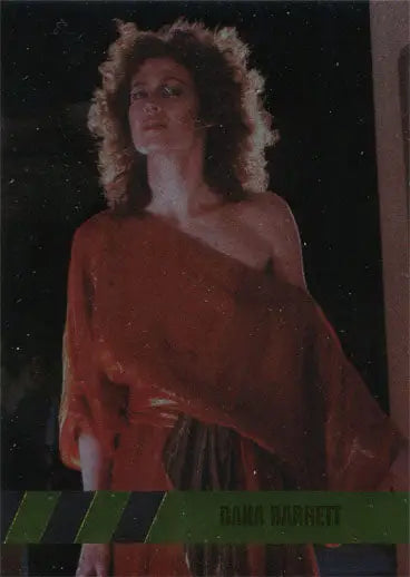 Person with voluminous curly hair in red garment from Ghostbusters Character Bios C3 Foil Parallel Chase Card
