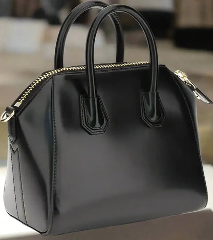 GIVENCHY Antigona mini handbag in black patent leather with gold zipper and top handles