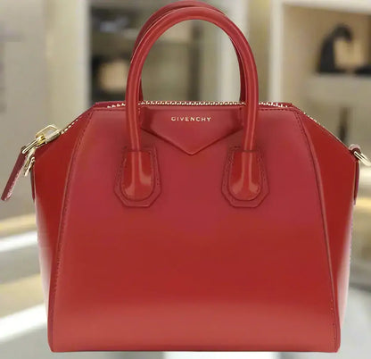 Shiny red leather GIVENCHY Antigona mini handbag with top handles and zipper closure