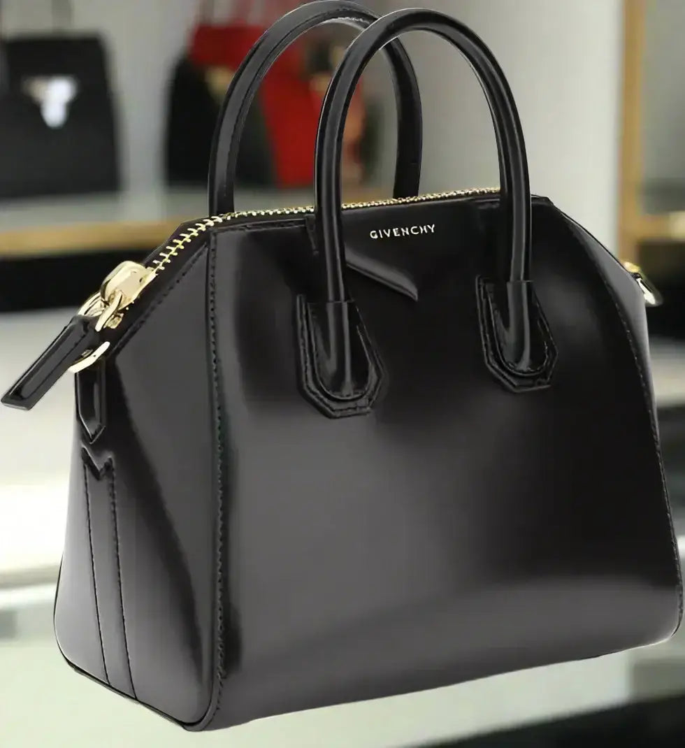 Shiny black leather GIVENCHY Antigona mini handbag with top handles and gold zipper
