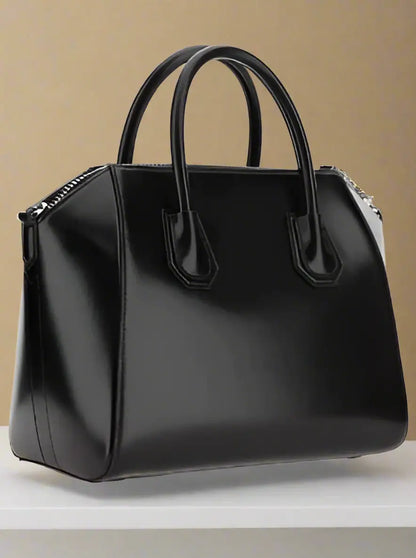 Shiny black leather Givenchy Antigona handbag with top handles and zipper closure