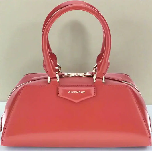 Shiny red Givenchy Antigona East West mini handbag with top handles and zipper closure