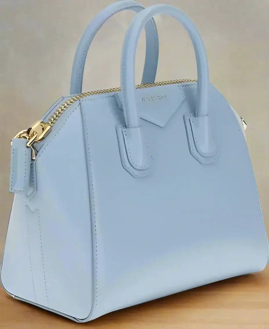 Light blue leather mini handbag with dual top handles and gold-tone zipper for GIVENCHY Women’s Sky Blue Antigona Mini Handbag