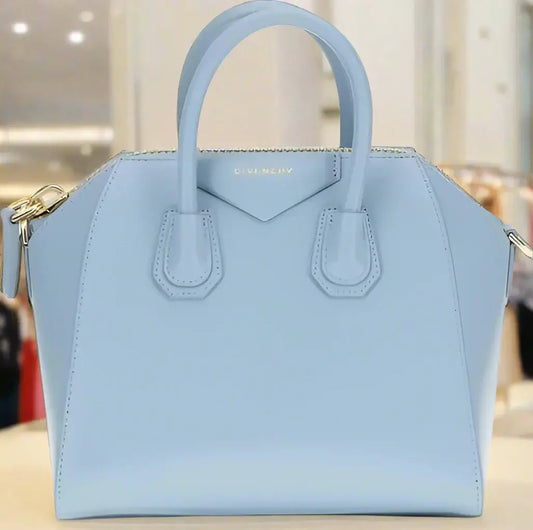 Light blue structured leather mini handbag with double handles and zipper closure