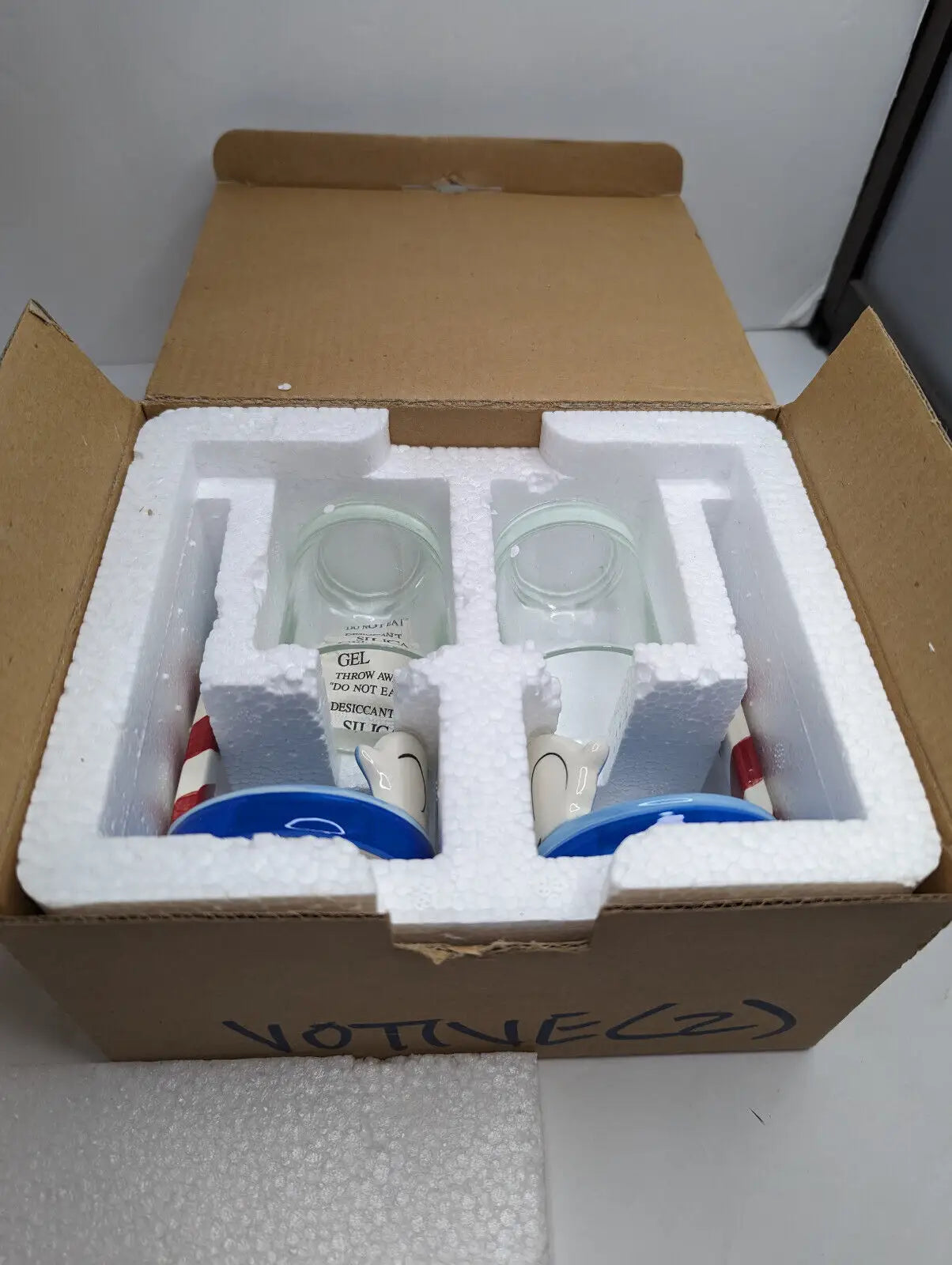 Two packaged lighthouse glasses from Gold Canyon Votive Pillar Candle Holders set