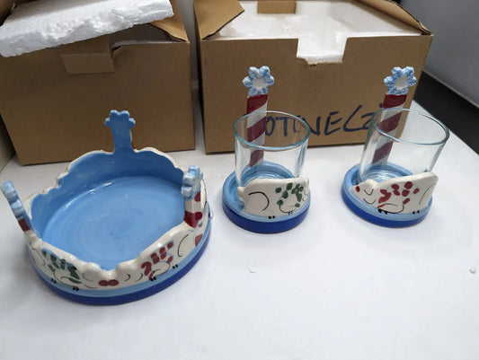 Ceramic serving set with whimsical animal designs from Gold Canyon Votive collection