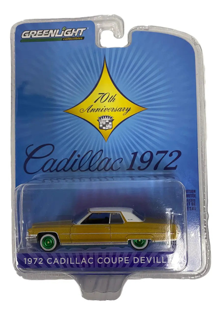 Die-cast model of a yellow 1972 Cadillac Coupe DeVille in packaging for Anniversary Series