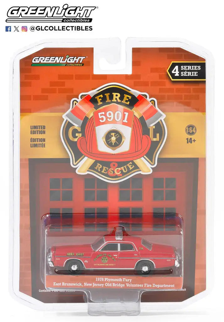 Die-cast model of a red Plymouth Fury E Brunswick vintage fire chief car in packaging