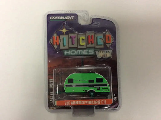 Packaged toy model of Green Winnebago Winnie Drop from Greenlight Hitched Homes series