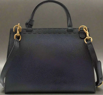 Black leather GG Marmont handbag with gold-tone hardware and detachable shoulder strap