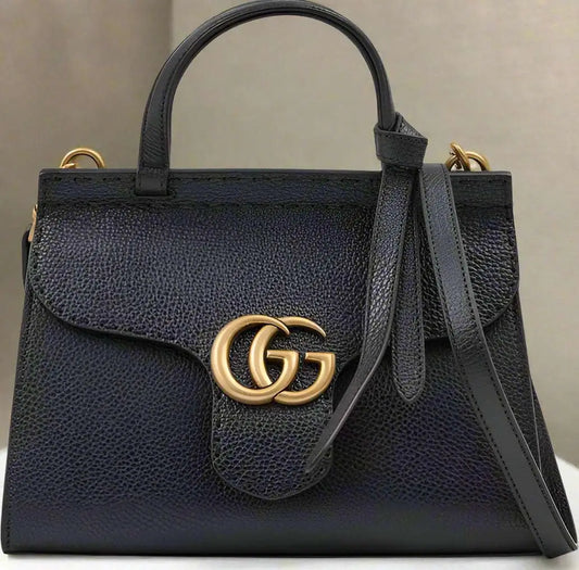 Textured black leather GG Marmont handbag with top handle shoulder strap and gold logo