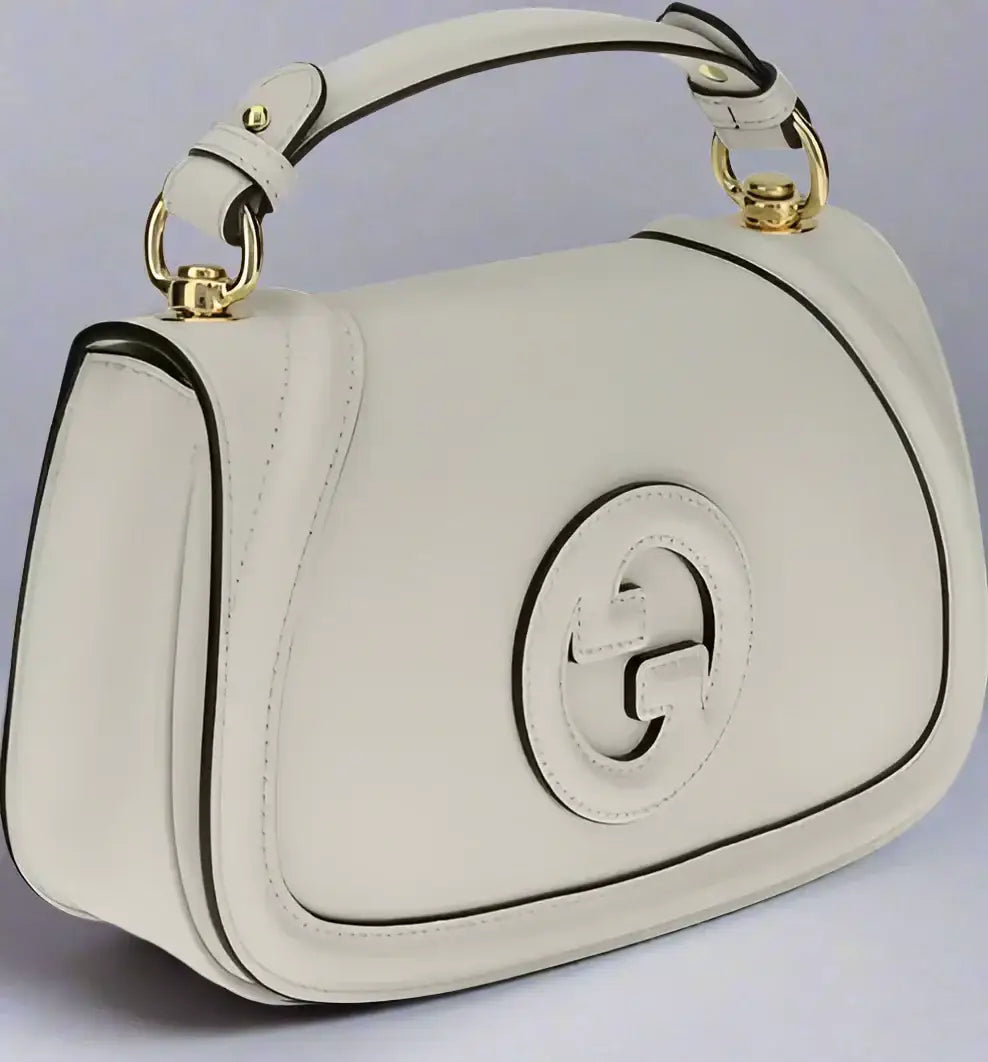 GUCCI Blondie Handbag with tonal leather, top handle, and interlocking G logo