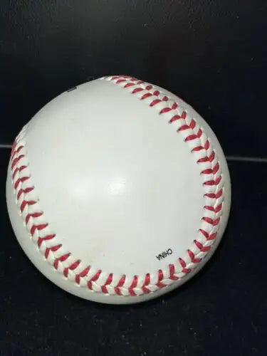 White baseball with red stitching from Halliburton Company’s limited edition Fotoball