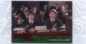 Two boys in formal attire with Harry Potter red foil trading cards promo set