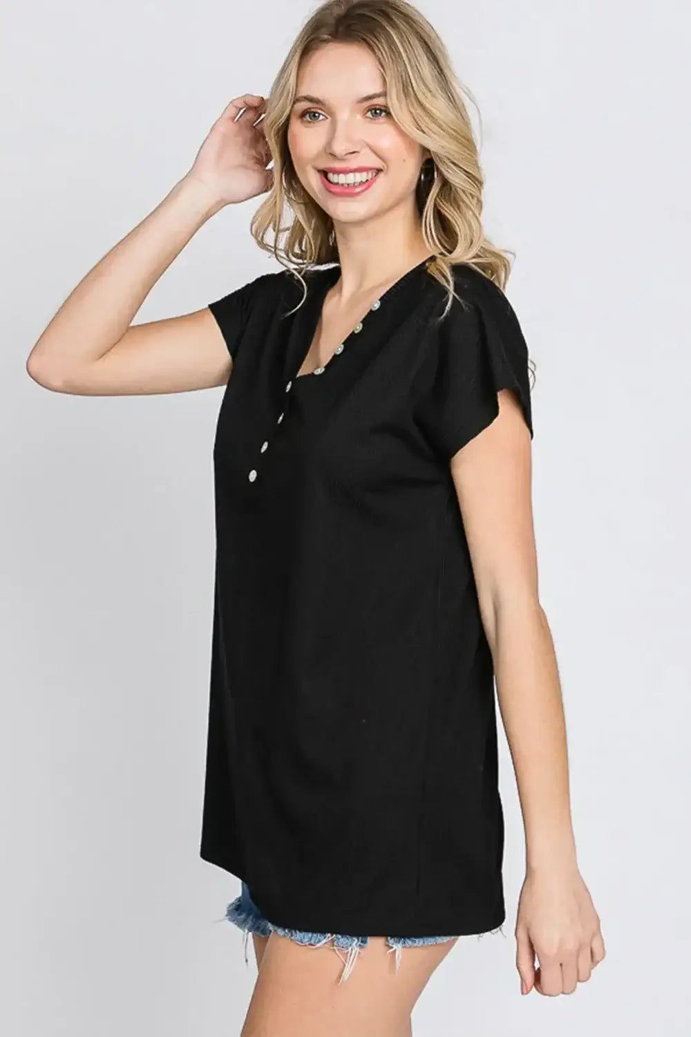 Black v-neck short sleeve T-shirt with ruffled sleeves and front button details
