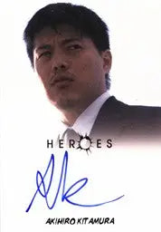 Signed autograph card of Akihiro Kitamura as Tadashi in a suit against a light background