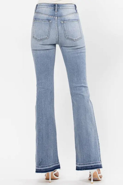 Light wash high rise flare jeans with raw cut hem and bottom detail