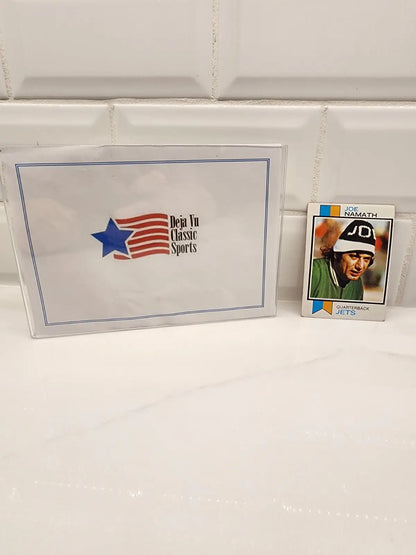 Sports memorabilia featuring a Joe Namath New York Jets football card from 1973