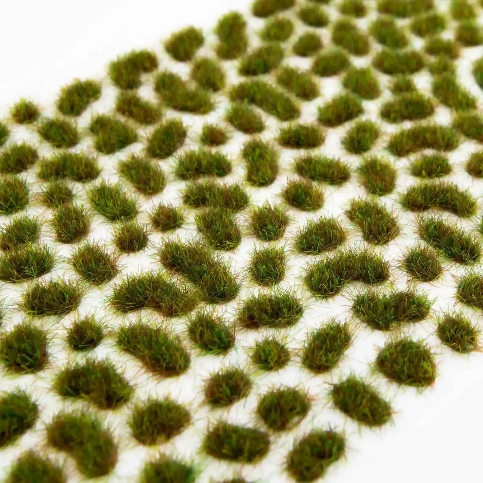Tufts of green model grass from Huge Miniatures Tufts & Flowers: Muddy Mini Tufts