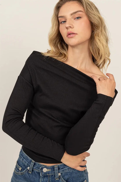 Black off-the-shoulder ribbed knit top with relaxed fit and soft fabric for stylish comfort