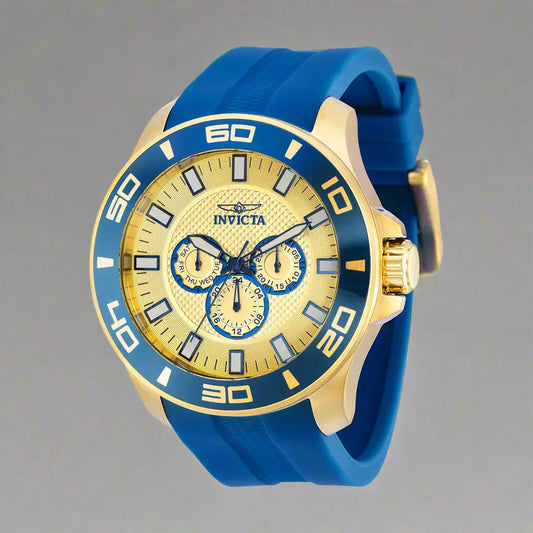Gold-tone chronograph watch with blue bezel and silicone strap from Invicta men’s yellow dial collection