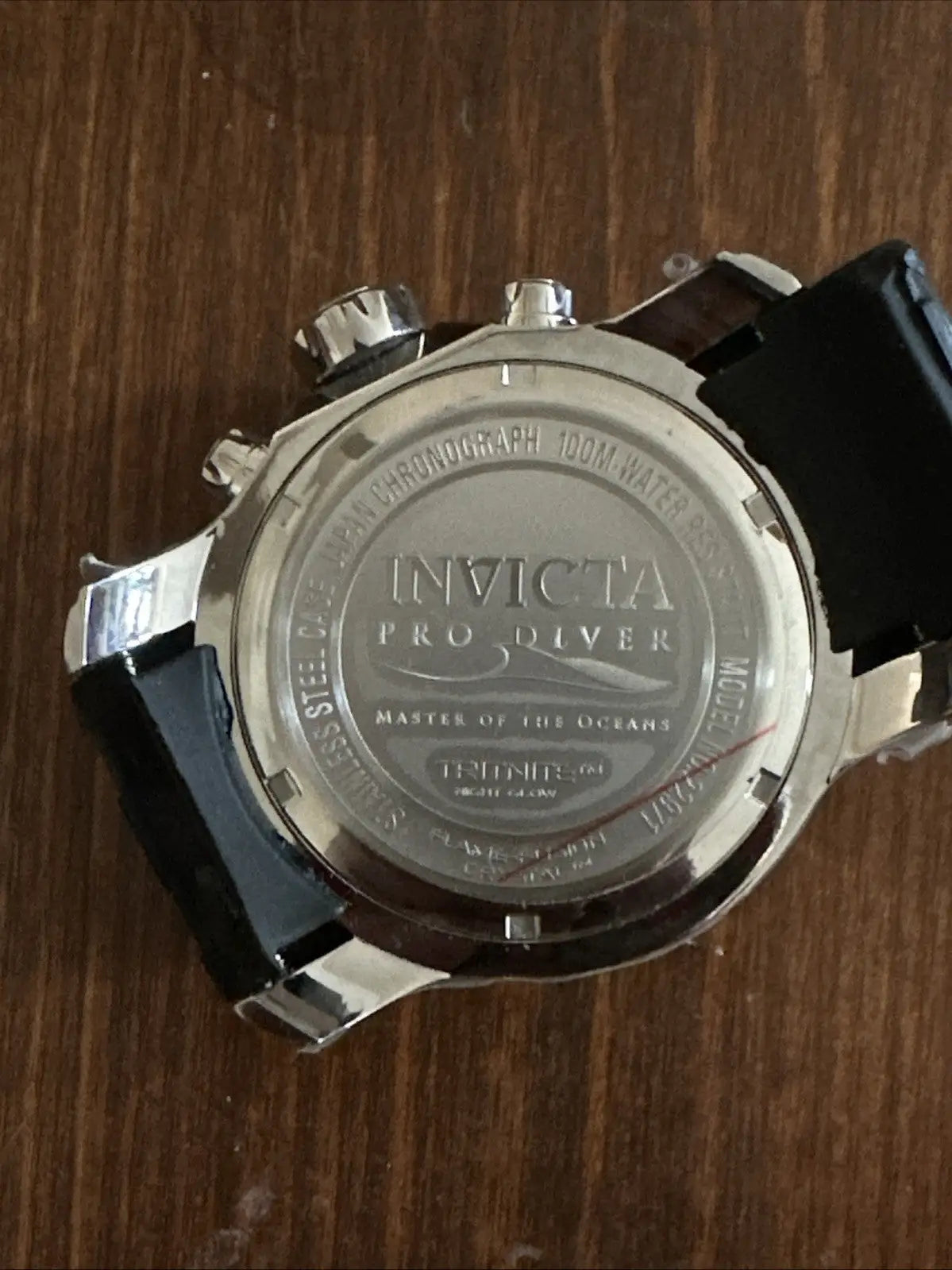 Back of Invicta Pro Diver 22971 stainless steel automatic watch with black rubber strap