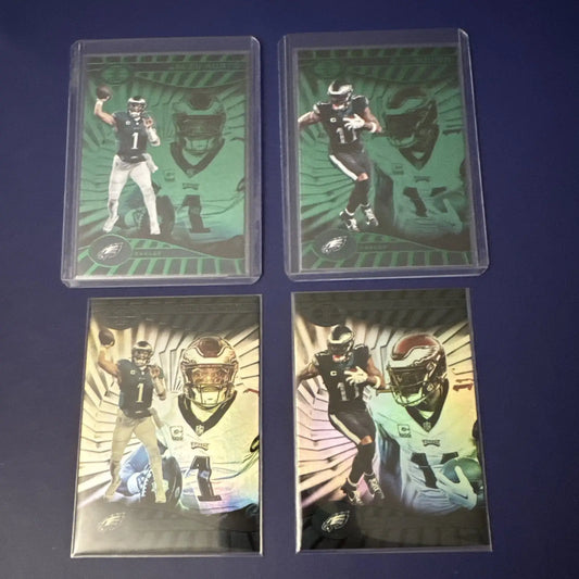 Philadelphia Eagles trading cards featuring Jalen Hurts in Panini Illusions Emerald and Base Color Match protective sleeves