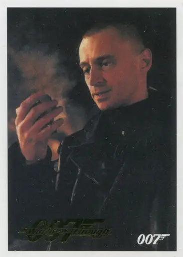 Man in dark clothing smoking, featured in James Bond 007 Classics Gold Parallel Trading Cards