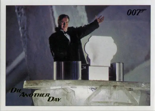 Man in a black suit gestures with arm raised in James Bond Gold Foil trading card image