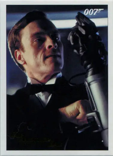 Man in tuxedo with gun featuring 007 logo on James Bond Archives Gold Foil Trading Card