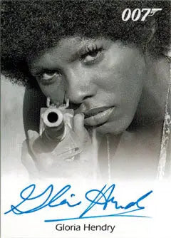 Close-up of Gloria Hendry as Rosie Carver aiming a gun on an autograph card