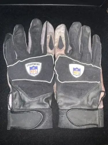 Pair of black NFL gloves worn by Jay Ratliff for Dallas Cowboys authentic equipment