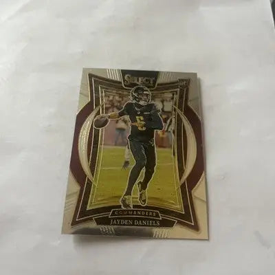 Football trading card featuring Jayden Daniels in Commanders uniform from Panini Select Rookie Concourse