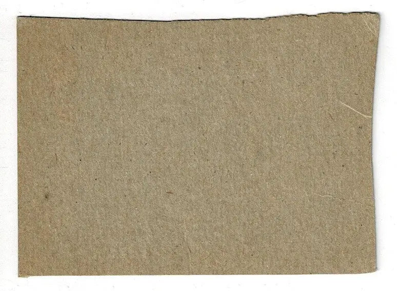 Brown coarse-textured cardboard piece from Jerry Lynch 1962 Post Cereal Reds baseball card