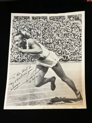 Signed black and white photo of Jesse Owens, PSA DNA certified, perfect for trading cards