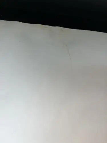 White wall with dark trim showcases Jesse Owens Auto 8x10 Photo Signed PSA DNA