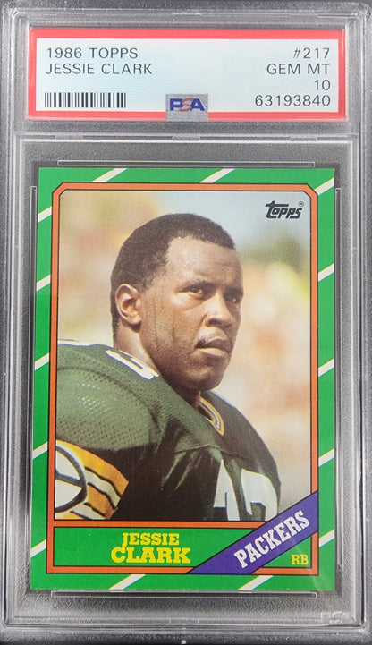 PSA-graded Jessie Clark 1986 Topps #217 Gem Mint football card with green and purple accents