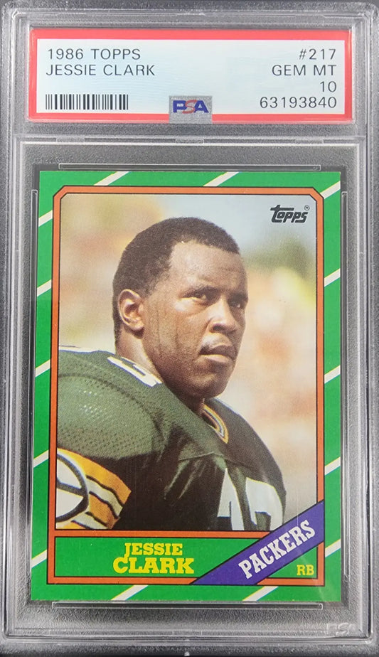 PSA-graded Jessie Clark 1986 Topps #217 Gem Mint football card with green and purple accents