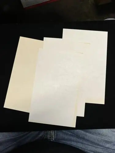 Stacked sheets of paper featuring Joey Maxim Las Vegas trading cards for collectors