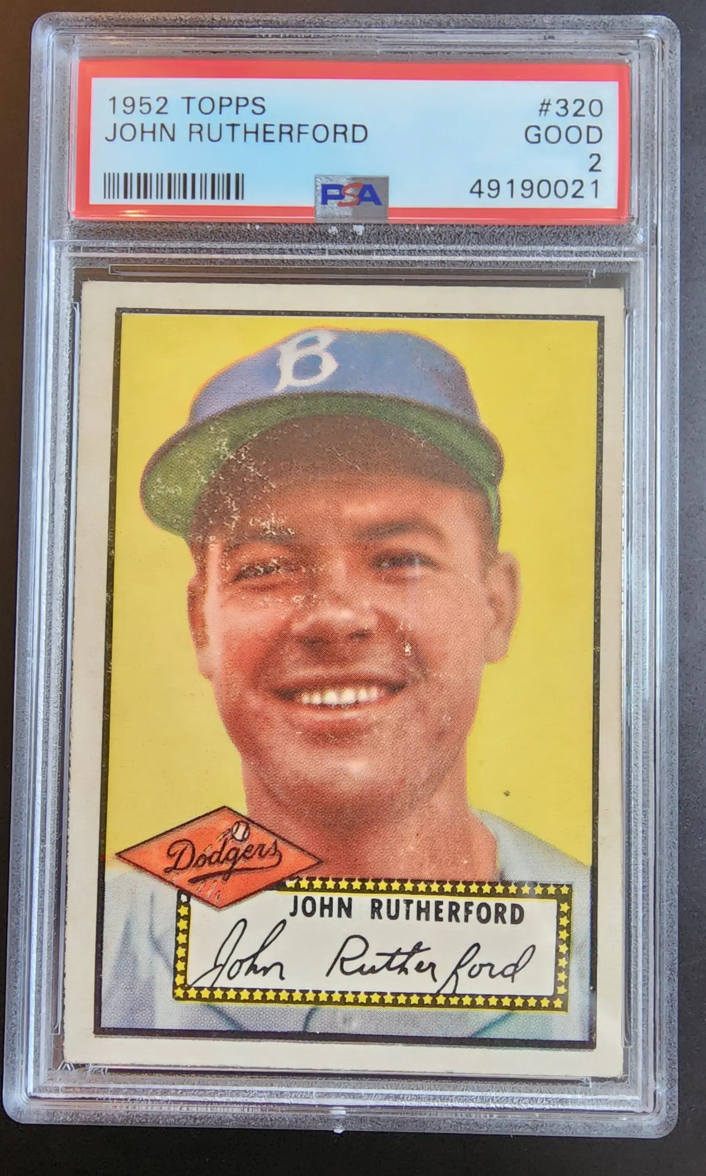 PSA-graded 1952 Topps John Rutherford baseball card in protective case for collectors