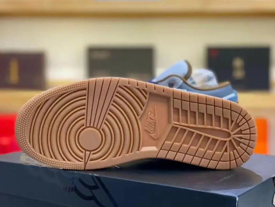 Brown sneaker sole with circular and grid pattern from Jordan 1 Low for fast shipping