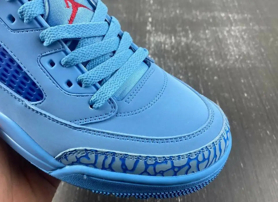 Light blue Jordan Spizike Low Houston Oilers sneaker with elephant print and red logo