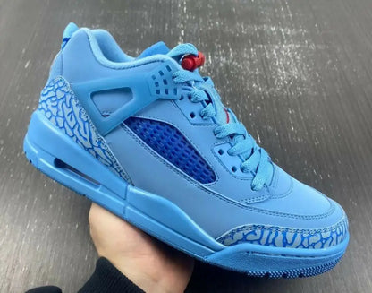 Light blue Jordan Spizike Low Houston Oilers athletic shoe with mesh and elephant print, fast shipping