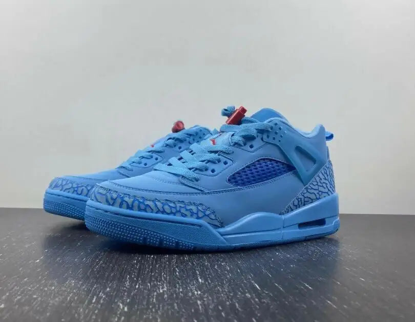 Light blue Jordan Spizike Low Houston Oilers athletic shoes with elephant print accents, fast shipping