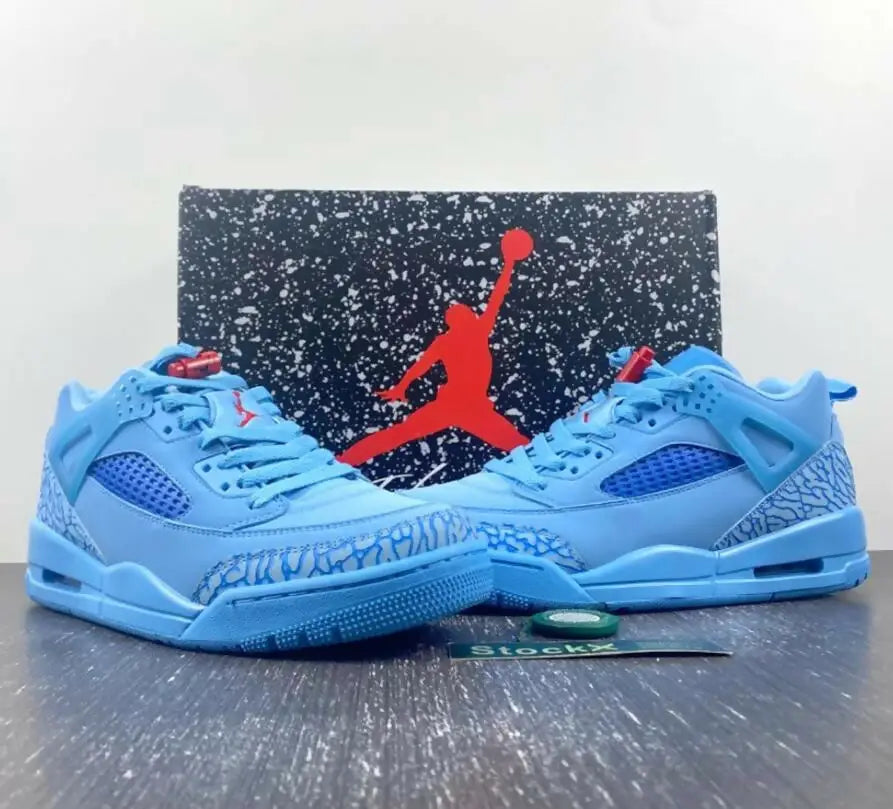 Light blue Air Jordan sneakers with red accents and speckled gray elephant print, fast shipping