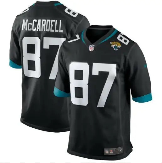 Two black Jacksonville Jaguars Nike jerseys with teal accents featuring Keenan McCardell Jacksonville design