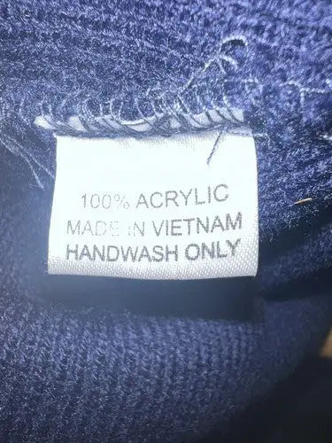 Clothing label for Kennedy Memorial Hockey Tournament Beanie made of 100% acrylic in Vietnam