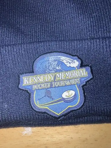 Navy blue knit beanie with embroidered patch for Kennedy Memorial Hockey Tournament